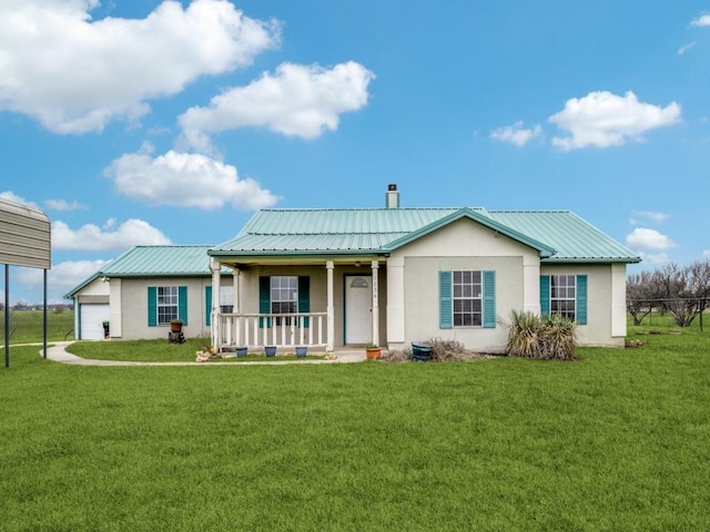 view of front of property with a porch, metal roof, a chimney, and stucco siding