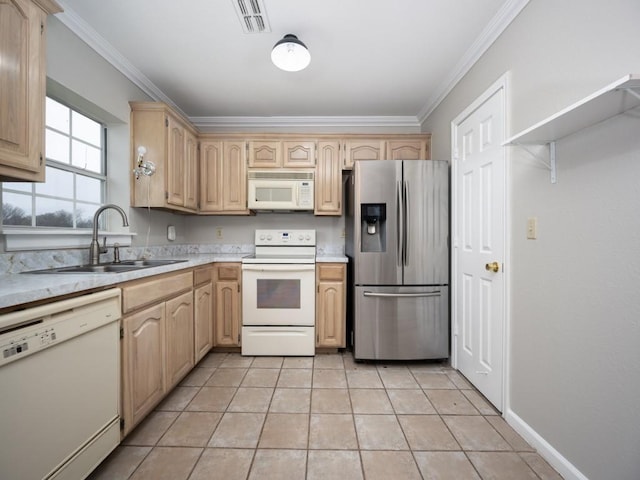 kitchen with light countertops, white appliances, a sink, and visible vents