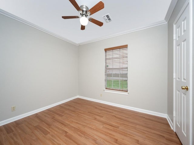 unfurnished room featuring crown molding, visible vents, light wood-style floors, ceiling fan, and baseboards