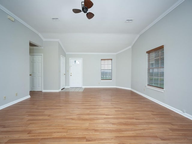 unfurnished living room featuring light wood-style floors, visible vents, plenty of natural light, and ornamental molding