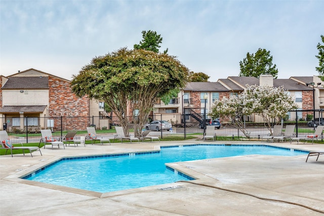 12480 Abrams Rd Unit 321, Dallas, TX 75243 - community pool featuring a patio and fence