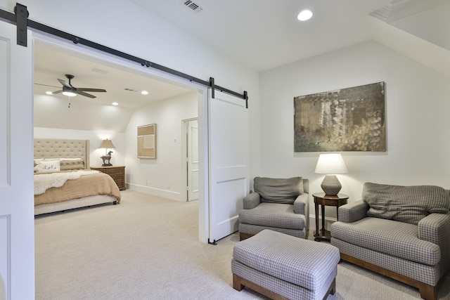 bedroom featuring recessed lighting, a barn door, visible vents, and light colored carpet