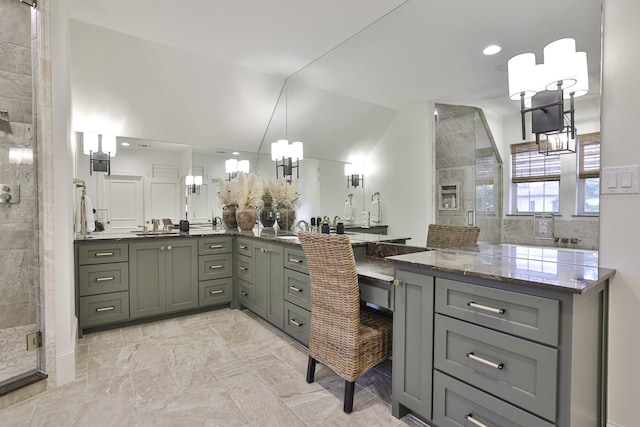 bathroom featuring recessed lighting, a shower stall, vaulted ceiling, and vanity