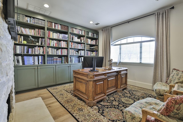 home office with light wood-style flooring, visible vents, baseboards, and recessed lighting