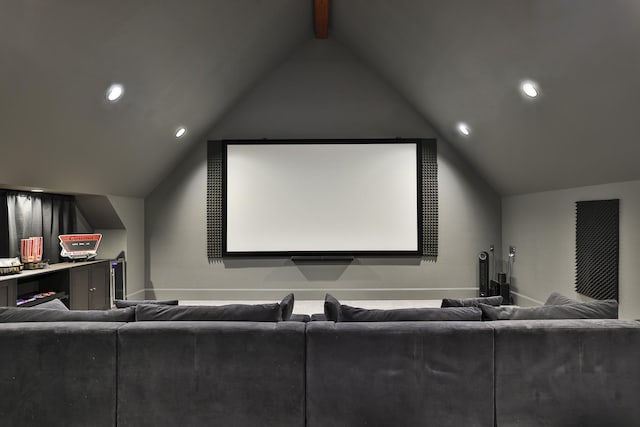 cinema room featuring recessed lighting, lofted ceiling with beams, and baseboards