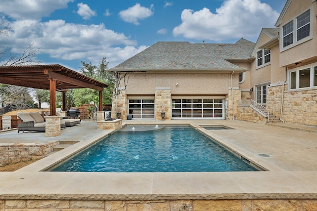 view of swimming pool featuring an in ground hot tub, a patio area, and a fenced in pool