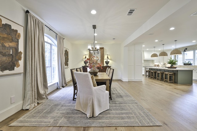 6600 Sahalee Dr, Fort Worth, TX 76132 - dining space with a chandelier, light wood-style flooring, and recessed lighting