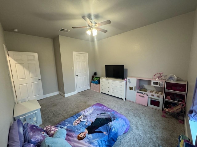 carpeted bedroom featuring ceiling fan, baseboards, and visible vents