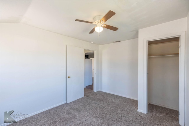 unfurnished bedroom featuring carpet, visible vents, ceiling fan, and a closet