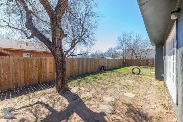 view of yard featuring a fenced backyard