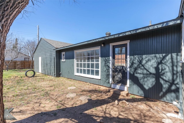 view of home's exterior featuring fence