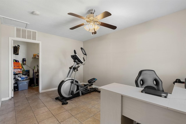 workout area featuring light tile patterned floors, ceiling fan, visible vents, and baseboards