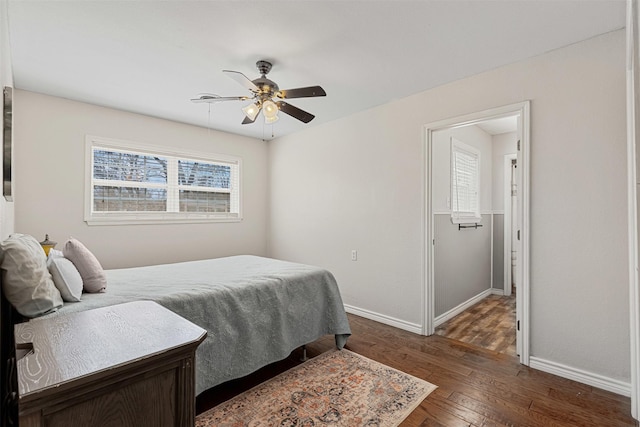 bedroom featuring a ceiling fan, baseboards, and hardwood / wood-style floors