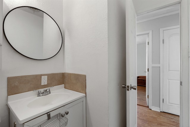 bathroom featuring vanity and wood finished floors