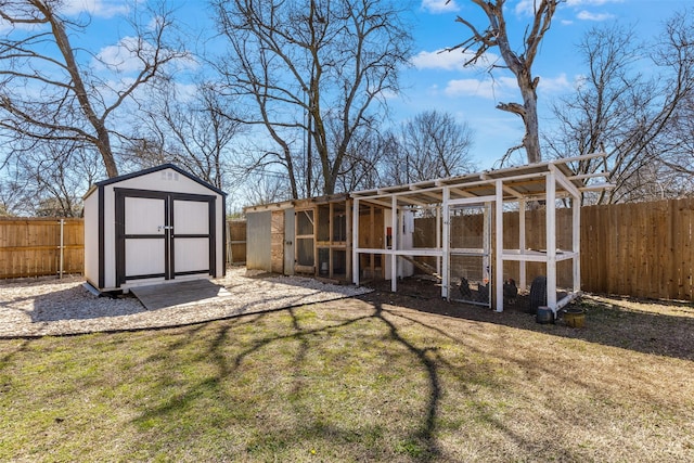 view of poultry coop with a yard and a fenced backyard