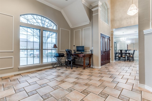 office space with high vaulted ceiling, a healthy amount of sunlight, baseboards, and an inviting chandelier