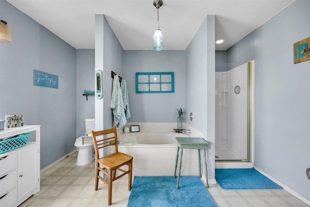 bathroom with baseboards, toilet, tile patterned floors, a garden tub, and a shower stall