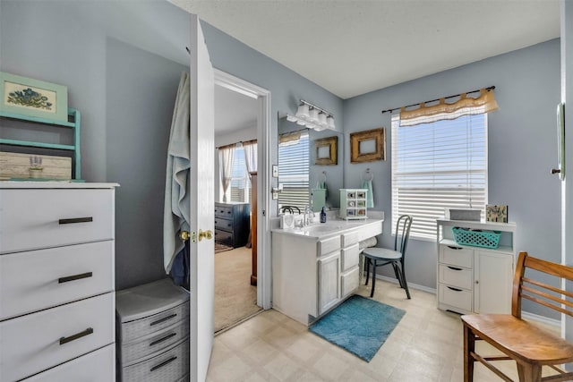 bathroom with vanity and tile patterned floors