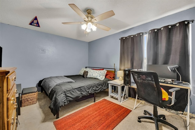 carpeted bedroom with a ceiling fan