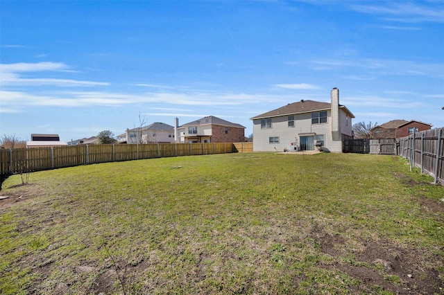 view of yard featuring a fenced backyard