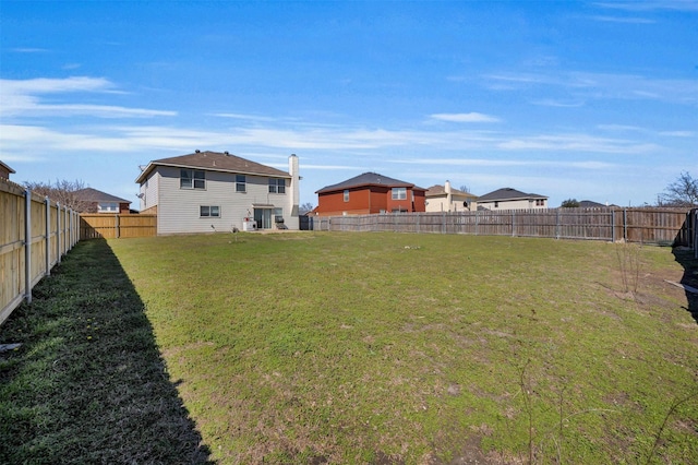 view of yard featuring a fenced backyard