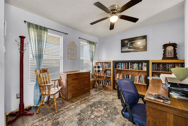 office area featuring a ceiling fan and wood finished floors