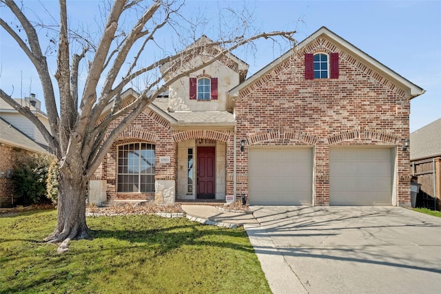 view of front facade with a garage, driveway, a front lawn, and brick siding