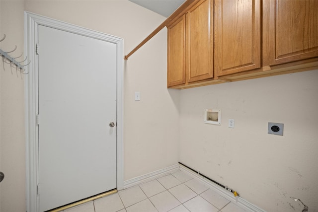 clothes washing area with washer hookup, hookup for a gas dryer, cabinet space, light tile patterned flooring, and electric dryer hookup