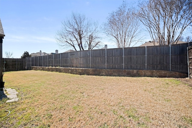 view of yard with a fenced backyard