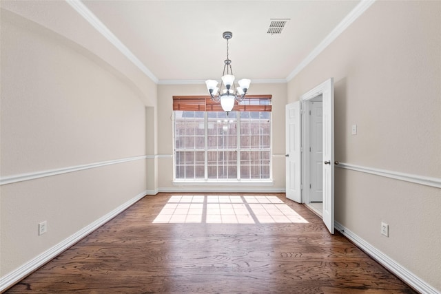 unfurnished dining area featuring visible vents, wood finished floors, and ornamental molding