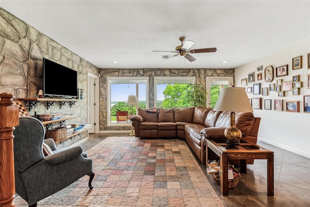 living area featuring visible vents, baseboards, a ceiling fan, and recessed lighting