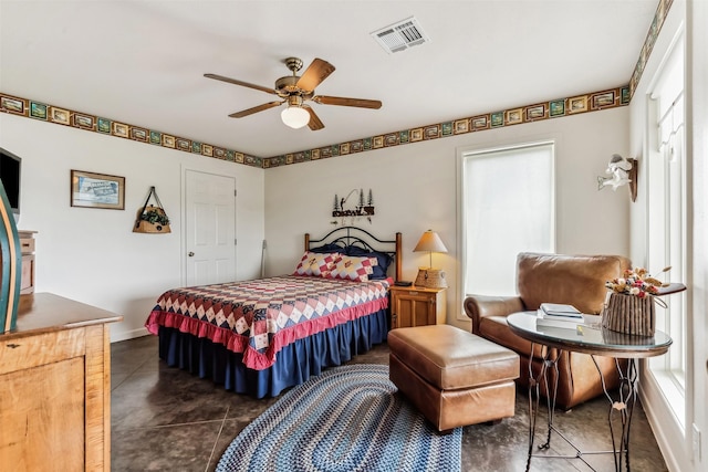 bedroom with a ceiling fan, visible vents, and baseboards