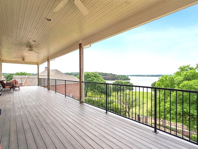 wooden terrace featuring a water view and ceiling fan