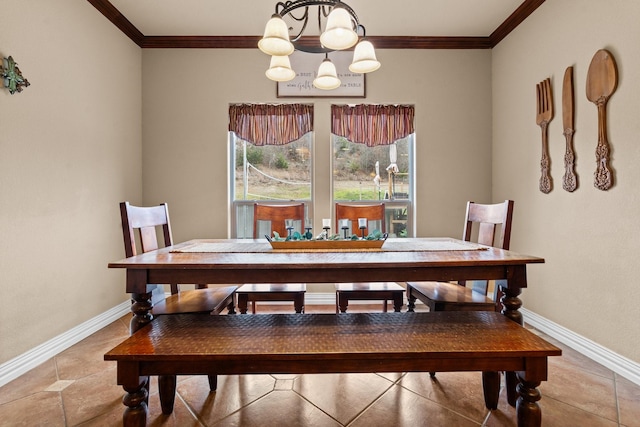 dining area with baseboards, an inviting chandelier, and crown molding