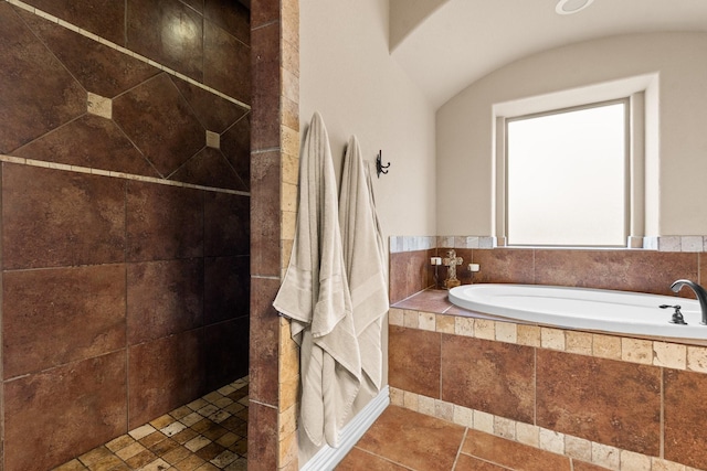 full bathroom featuring a tile shower and a garden tub