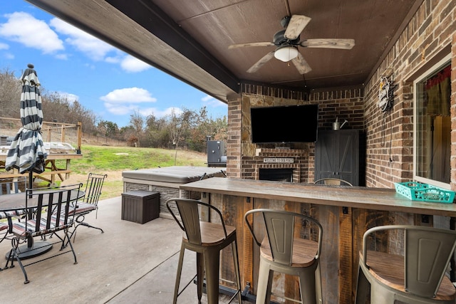 view of patio with ceiling fan and outdoor wet bar