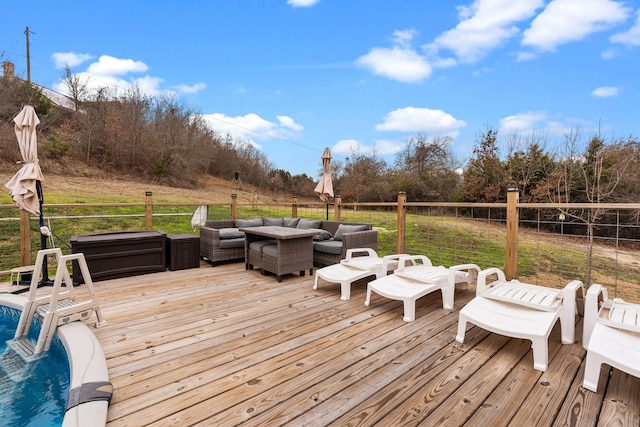 wooden terrace featuring an outdoor hangout area