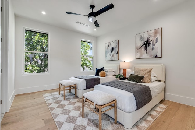 bedroom with ceiling fan, recessed lighting, visible vents, baseboards, and light wood-type flooring