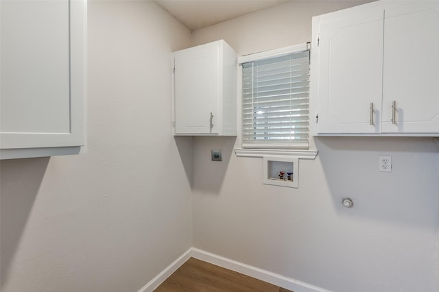 laundry room featuring dark wood-style flooring, washer hookup, baseboards, cabinet space, and electric dryer hookup