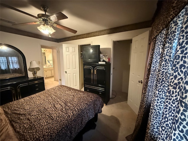 bedroom featuring a ceiling fan, connected bathroom, visible vents, and light colored carpet