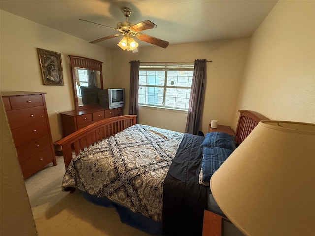 bedroom featuring ceiling fan and light colored carpet