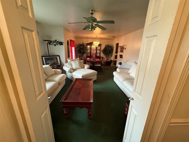 living area featuring carpet floors and ceiling fan with notable chandelier