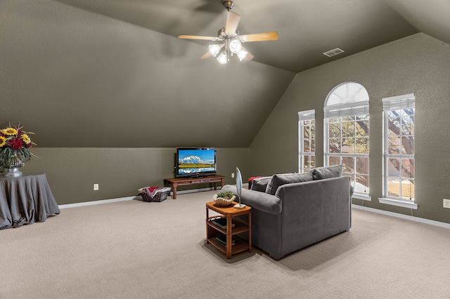 living area with lofted ceiling, a wealth of natural light, visible vents, and carpet floors