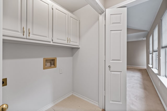 laundry room featuring cabinet space, baseboards, light floors, washer hookup, and electric dryer hookup