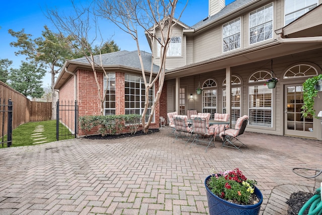 view of patio / terrace featuring fence and outdoor dining space