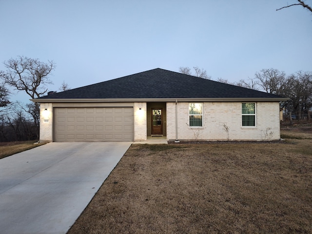 ranch-style house with concrete driveway, brick siding, and a garage