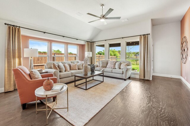 living room featuring baseboards, visible vents, vaulted ceiling, and wood finished floors