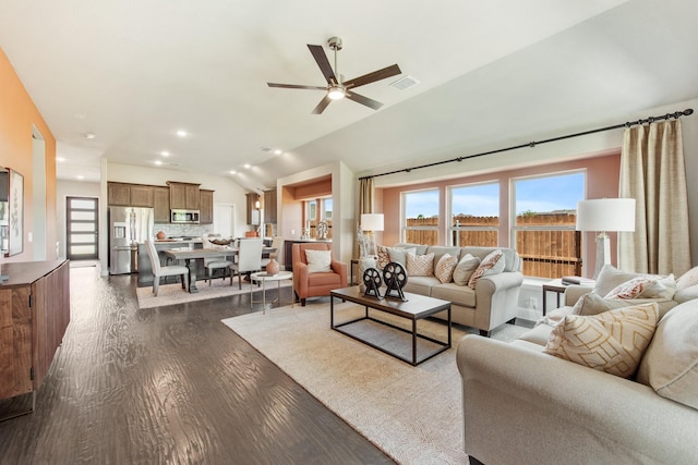 living area featuring dark wood-style floors, recessed lighting, visible vents, a ceiling fan, and vaulted ceiling