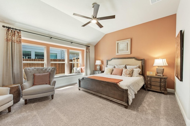 carpeted bedroom with lofted ceiling, ceiling fan, and baseboards