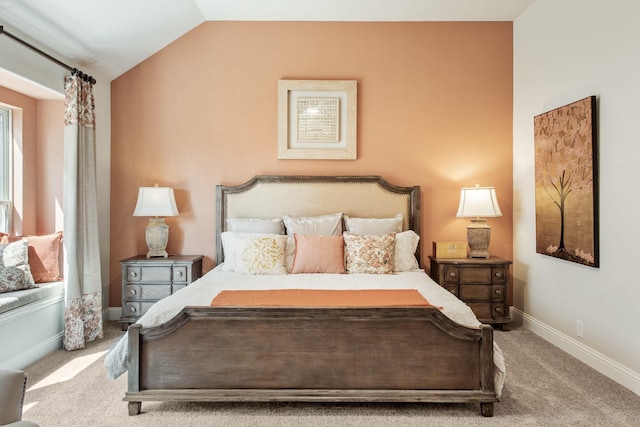 bedroom featuring carpet floors, vaulted ceiling, and baseboards